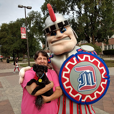 Success Coach Sr. Sarah Foster with her dog Bentley, the SSC therapy dog!