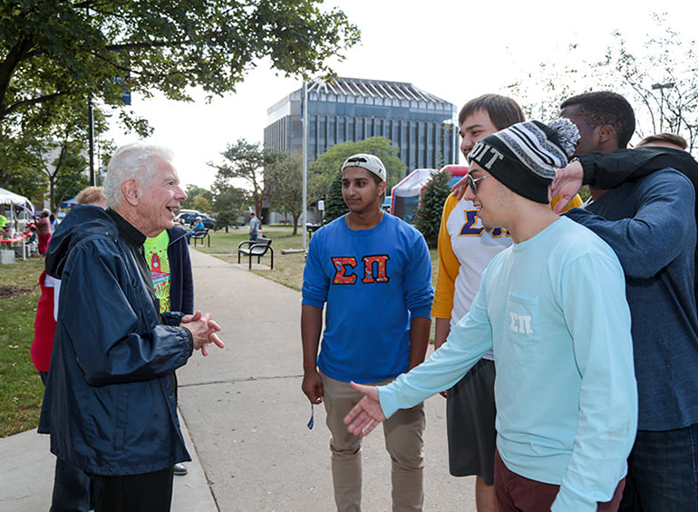Fr. Cavanagh outside with students