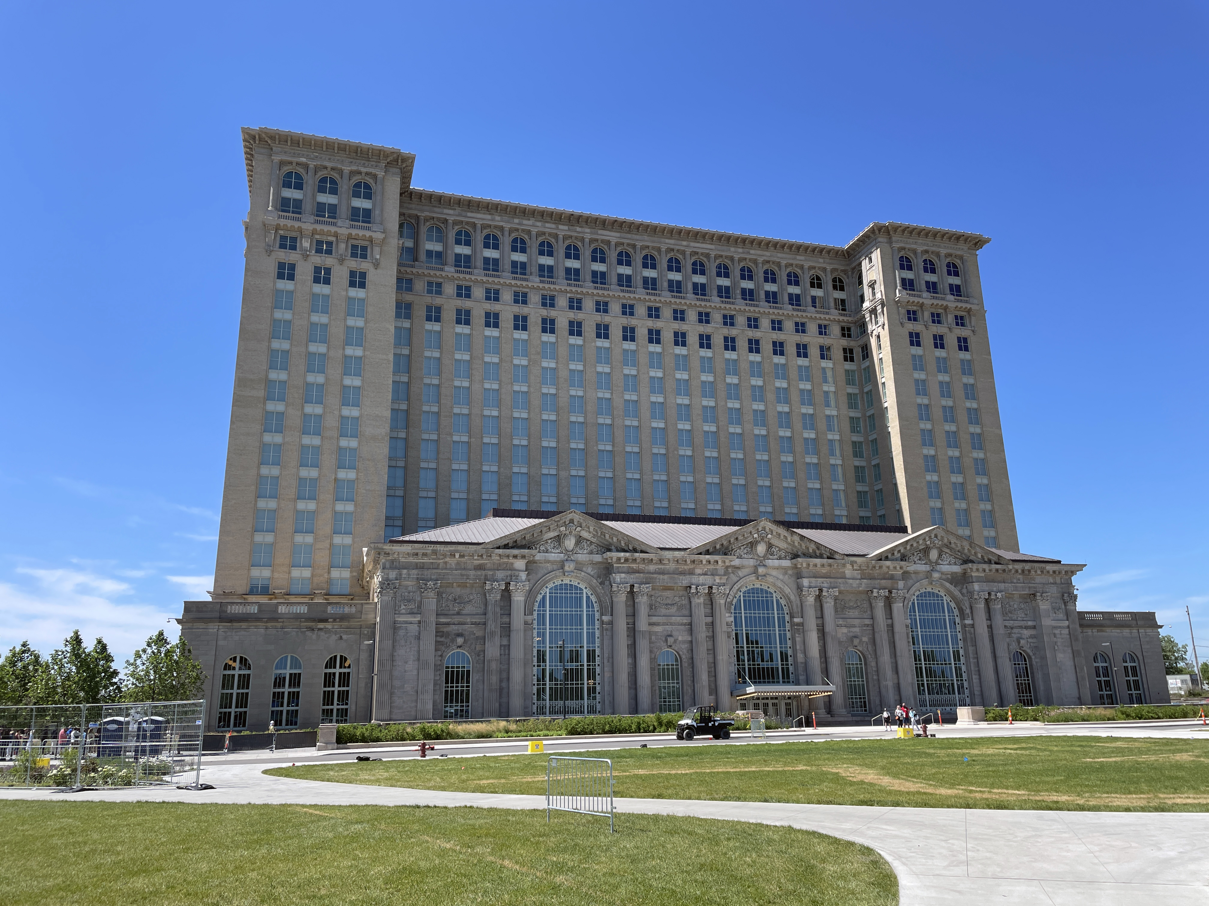 An outdoor photo of the updated Michigan Central Station on a sunny, blue-sky day.