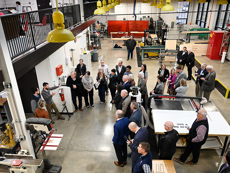 People stand inside of the new annex.