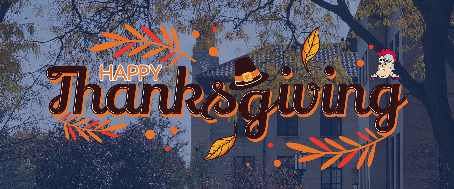 A graphic reading Happy Thanksgiving, with an outdoor photo of the McNichols Campus with clock tower, buildings and colorful trees.