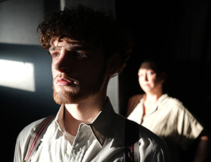 Josiah Martelle as Tom and Karen Kron Dickson '94 as Amanda in Detroit Mercy Theatre Company's The Glass Menagerie.