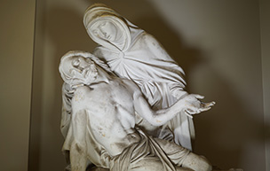 A statue depicting Mary holding Jesus’ body after his crucifixion sits at Detroit Mercy Law.
