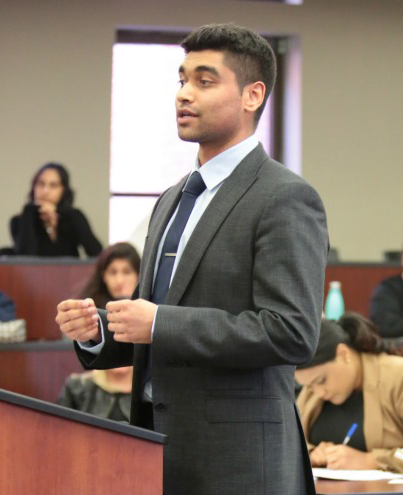 male law student in moot court