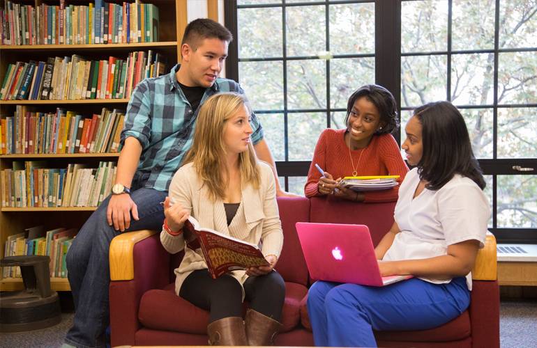 Kids sitting in library