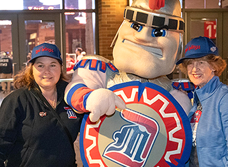 tommy titan and two alumni