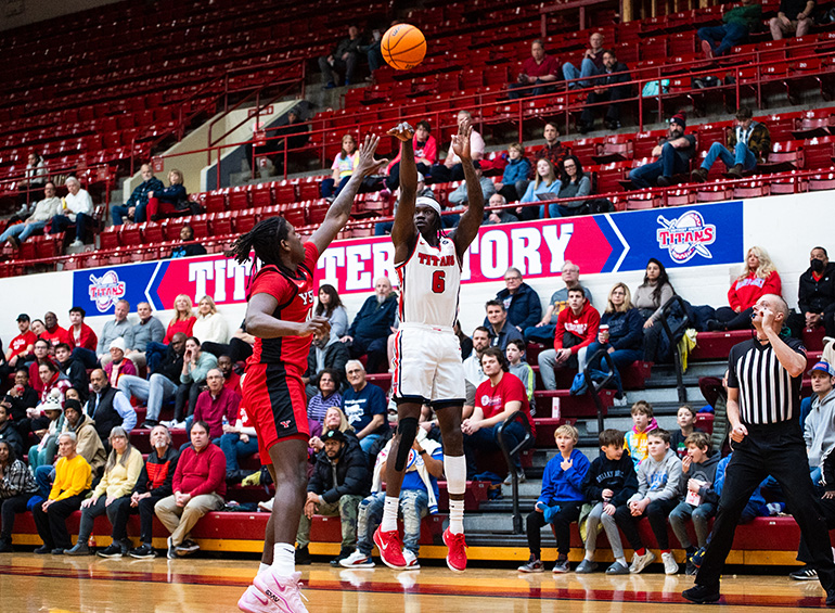 titans mens basketball team member shooting the ball
