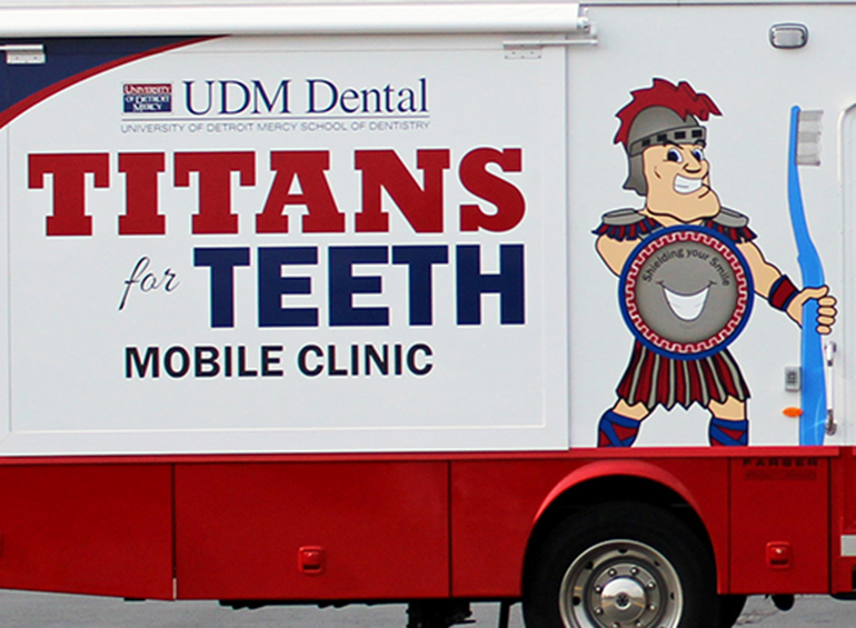 Titans for Teeth Mobile Clinic -- side of the clinic vehicle