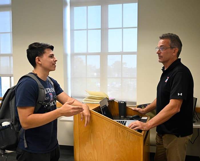 student and  prof chatting