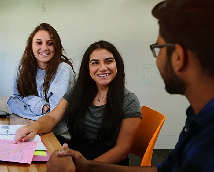 students smiling and chatting