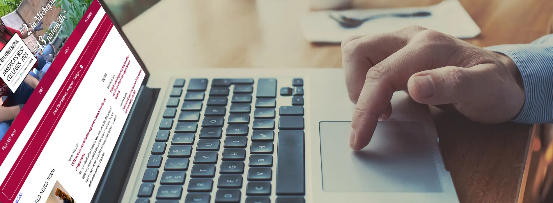 hands at keyboard looking the UDM website