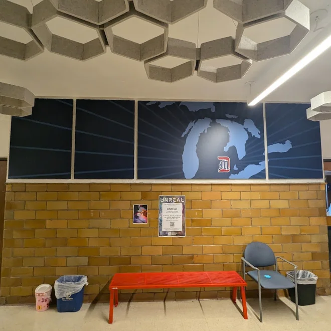 Photo of wall art on 3rd floor of the Engineering building. Art depicts the state of Michigan with UDM's logo over Detroit