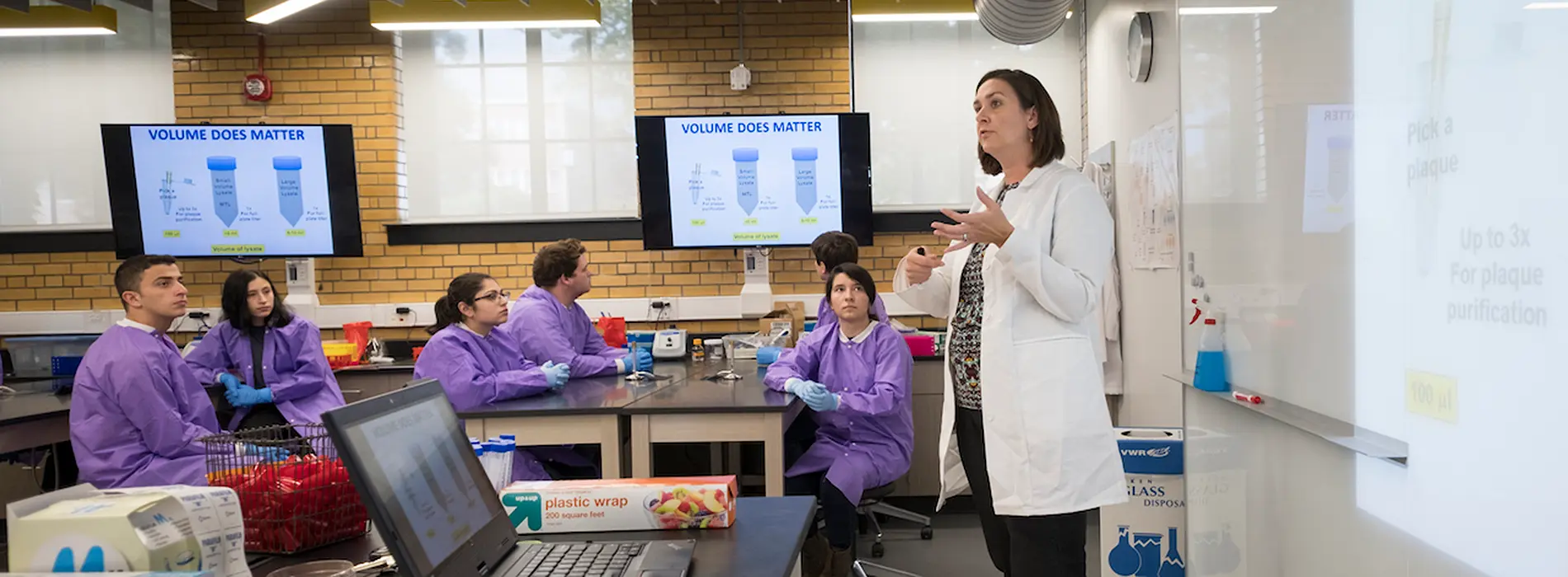 professor in lab teaching students