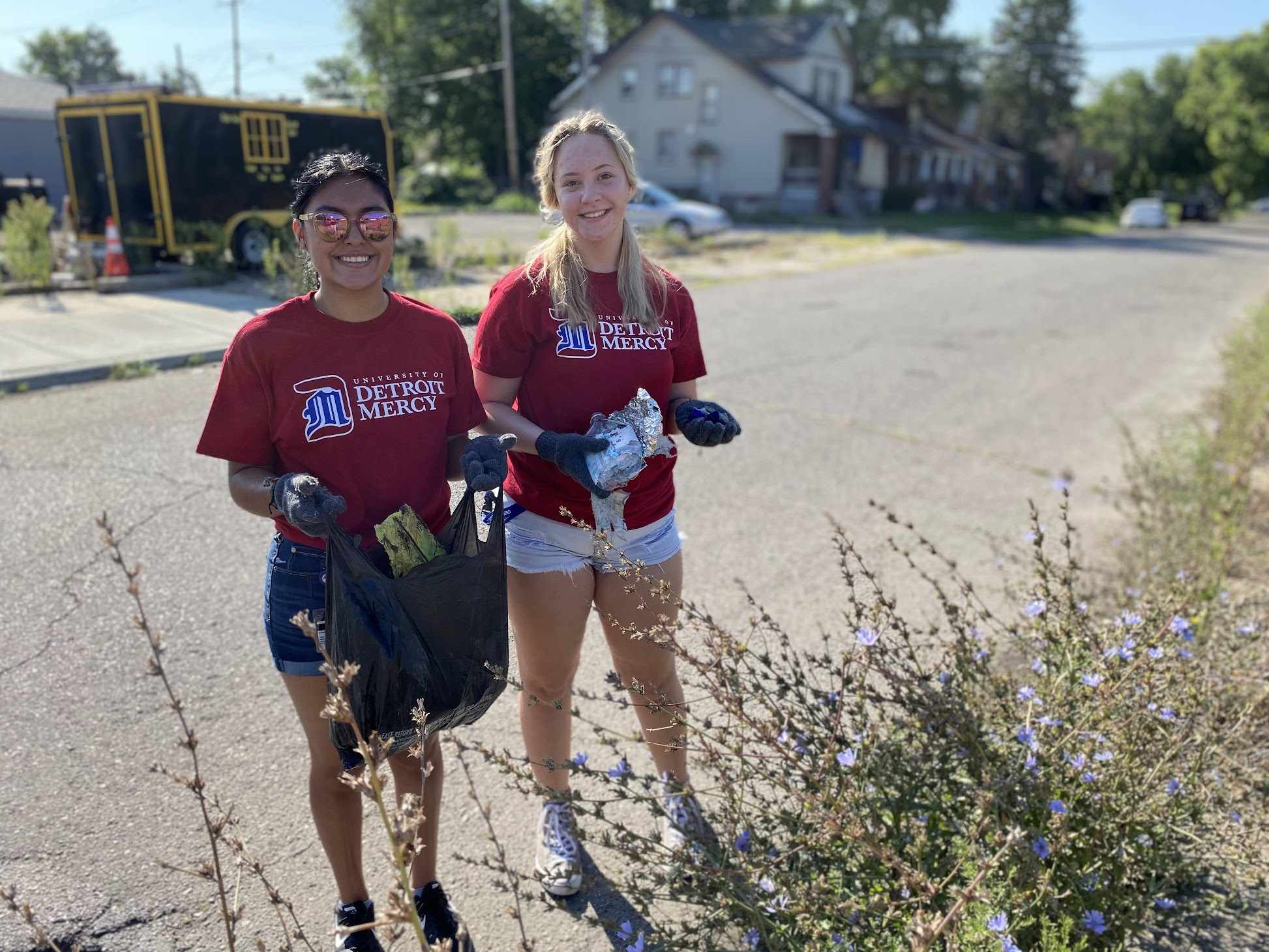 students weeding our neighborhood