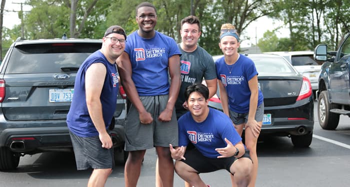 group of students in blue Detroit Mercy tshirts